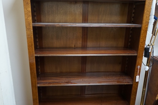 An Edwardian design bird's eye maple open bookcase, length 127cm, depth 32cm, height 193cm